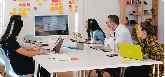 Team of young people collaborating in a meeting room